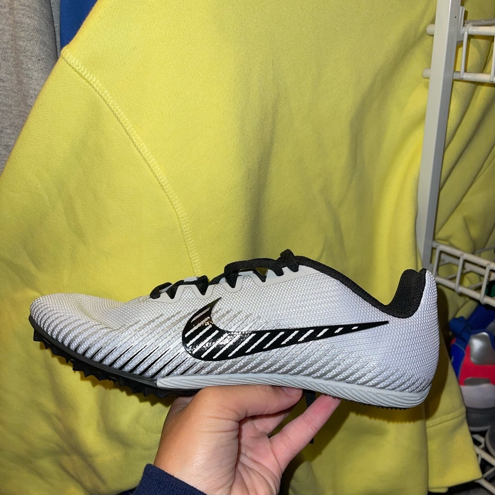 Track shoes, spikes and bag